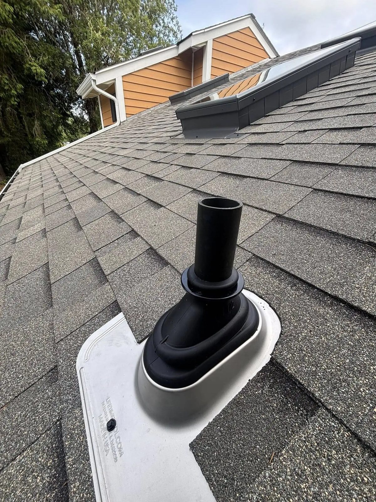 Pacific Peaks Roofing project: gutter and downspout detailing